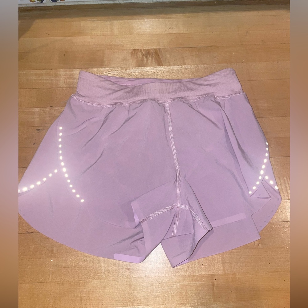 Light pink flowy lululemon shorts. Size 2. Brand new